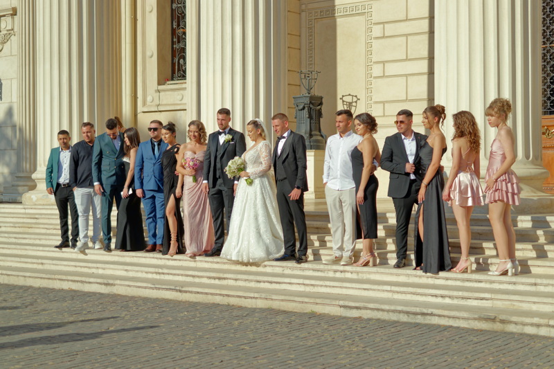 People posing at a wedding event